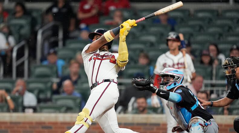 Atlanta Braves' Ronald Acuña Jr. (13) hits a two-run homer against the Miami Marlins in the third inning of a baseball game, Thursday, Aug. 6, 2026, in Atlanta. (AP Photo/Mike Stewart)