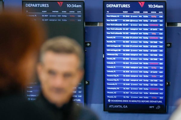 Delta Air Lines departure screens at Hartsfield-Jackson Atlanta International Airport display cancellations affecting passengers on Monday, Nov. 10, 2025. (Miguel Martinez/ AJC)