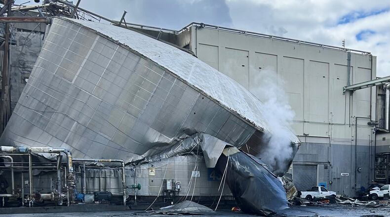 This photo provided by the City of Longview, Wash., shows structural damage to the Nippon Dynawave Packaging Co., after a tank containing hazardous liquid imploded, on Tuesday, May 26, 2026 in Longview, Wash. (City of Longview via AP)