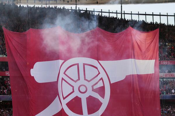 Arsenal fans hang a banner during the Champions League semifinal first leg soccer match between Arsenal and Paris Saint-Germain at Arsenal Stadium in London, England, Tuesday, April 29, 2025. (AP Photo/Kin Cheung)