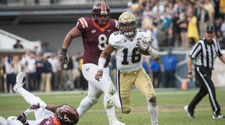 Georgia Tech quarterback TaQuon Marshall (16) runs leaving Virginia Tech defensive end Emmanuel Belmar (40) in the grass and defensive tackle Ricky Walker (8) giving chase during the second half of a football game on Saturday, Nov.11, 2017, in Atlanta. (Photo/John Amis)