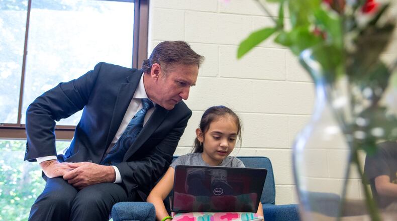 Fulton County Schools Superintendent Mike Looney speaks with Karolina, 9, as he tours Evoline C. West Elementary School on Thursday, June 13, 2019. Looney’s first official day on the job is Monday, June 17. CASEY SYKES FOR THE ATLANTA JOURNAL-CONSTITUTION
