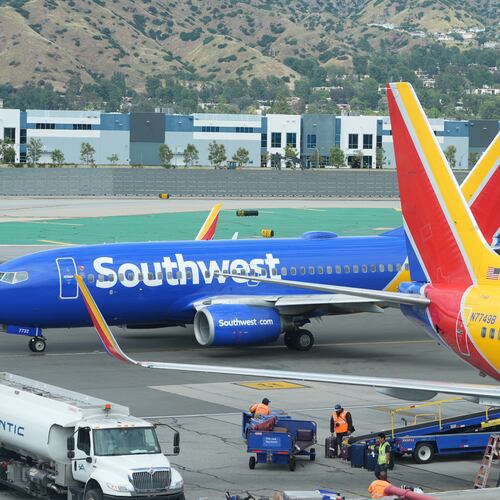 Southwest Airlines grounds crew refuel an aircraft at Hollywood Burbank Airport in Burbank, Calif., Friday, April 10, 2026. (AP Photo/Damian Dovarganes)