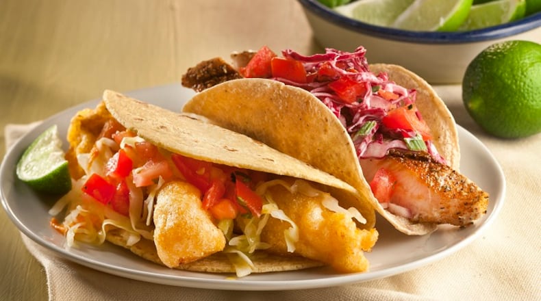 Baja fish tacos come together easily with a quick and easy batter. Finish them with salsa, slaw and a squirt of lime. (Bill Hogan/ Chicago Tribune/TNS)