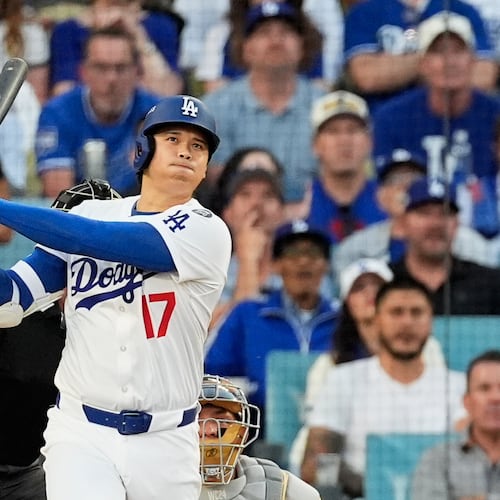 FILE - Los Angeles Dodgers' Shohei Ohtani watches his home run during the first inning against the Milwaukee Brewers in Game 4 in baseball's National League Championship Series, Friday, Oct. 17, 2025, in Los Angeles. (AP Photo/Mark J. Terrill, File)