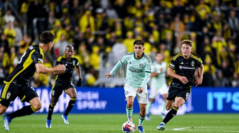 Atlanta United's Thiago Almada dribbles against the Columbus Crew Sunday in Game 3 of their MLS playoff series.