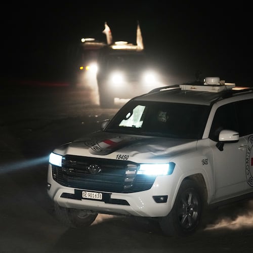 Red Cross vehicles carrying the bodies of three people believed to be deceased hostages handed over by Hamas make their way toward the border crossing with Israel, to be transferred to Israeli authorities, in Deir al-Balah, central Gaza Strip, Sunday, Nov. 2, 2025. (AP Photo/Jehad Alshrafi)