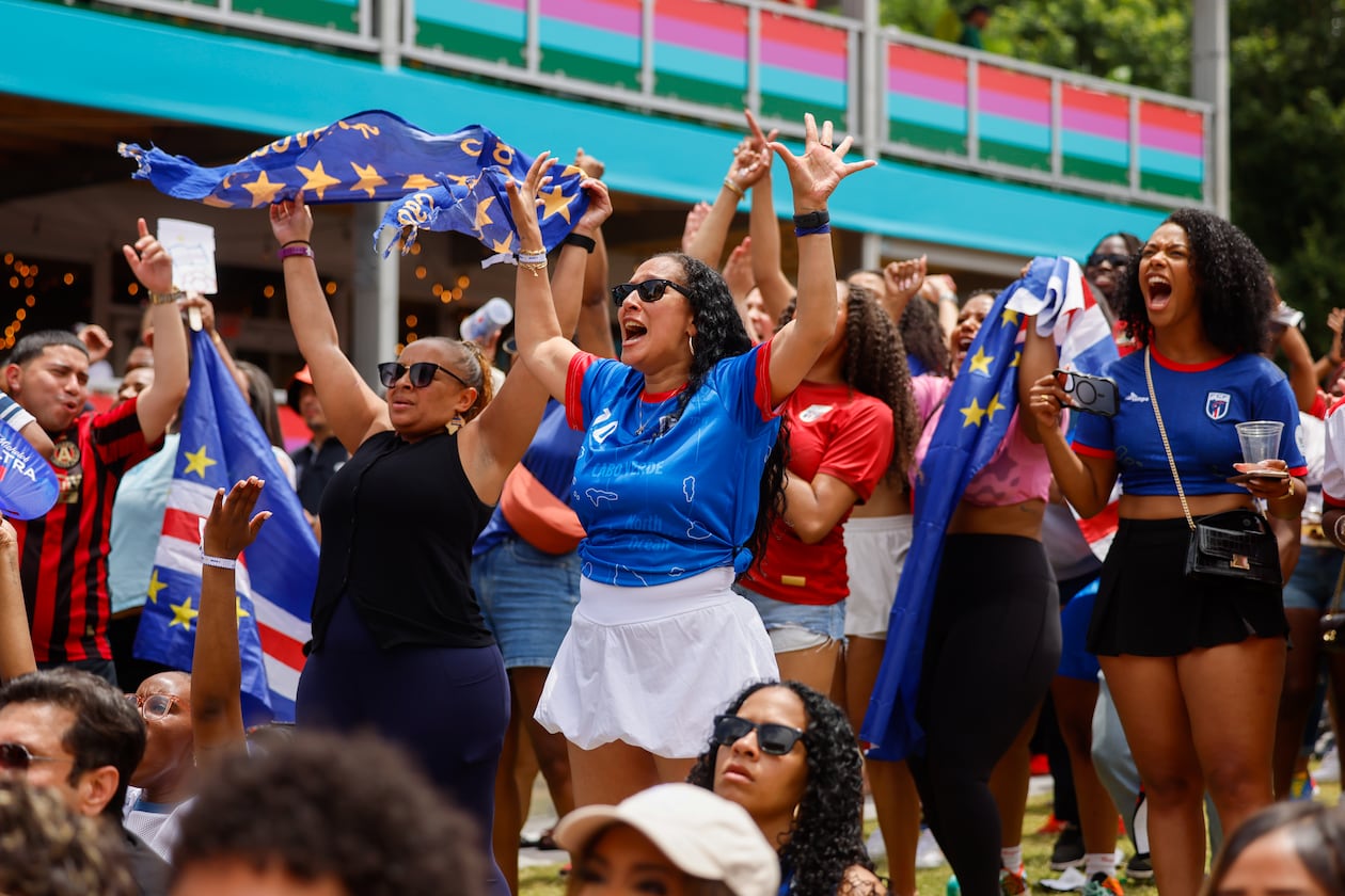 Cape Verde fans celebrate following a 0-0 draw at FIFA Fan Festival in Centennial Olympic Park during the Spain and Cape Verde match at the 2026 FIFA World Cup in Atlanta on June 15, 2026. It’s the first of eight World Cup matches to take place in Atlanta. It’s Cape Verde’s first World Cup. (Arvin Temkar/AJC)