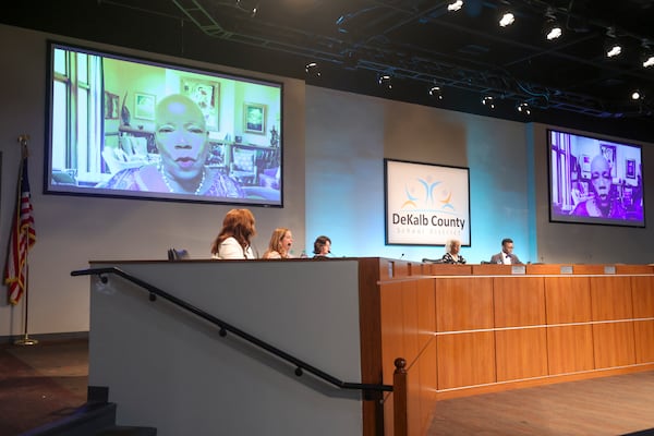 District 7 board member Joyce Morley (on the screen) was the lone opposition when it came time to vote on hiring Devon Horton. (Jason Getz/AJC)
