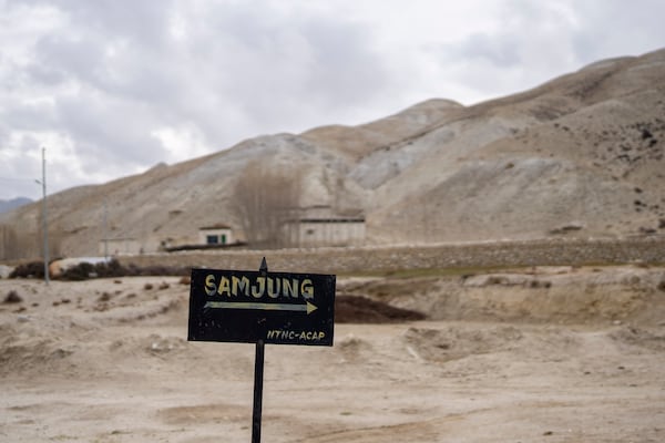 A signboard points the way to the newly relocated settlement of the abandoned Samjung village in the Mustang region, 462 kilometers (288 miles) west of Kathmandu, Nepal, Saturday, April 19, 2025. (AP Photo/Niranjan Shrestha)