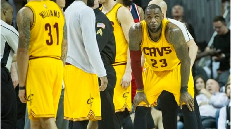 Cleveland Cavaliers' LeBron James (23) catches his breath after being hit in the groin, during the second half of an NBA basketball game against the Washington Wizards in Cleveland, Saturday, March 25, 2017. The Wizards won 127-115. (AP Photo/Phil Long)
