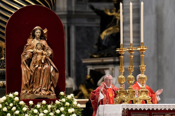 Cardinal Pietro Parolin, left, celebrates a final Mass celebrated by cardinals inside St. Peter's Basilica, before the conclave to elect a new pope, at the Vatican, Wednesday, May 7, 2025. (AP Photo/Gregorio Borgia)