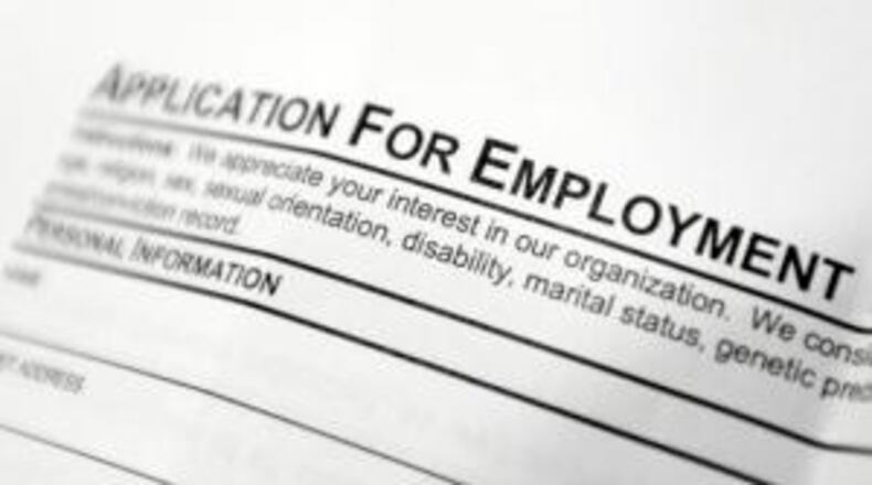This April 22, 2014, file photo shows an employment application form on a table during a job fair at Columbia-Greene Community College in Hudson, N.Y. The Labor Department released its weekly report on applications for unemployment benefits on Thursday, Sept. 1, 2016. Slightly more Americans sought unemployment benefits during the previous week, but the overall levels still remain near historic lows in a positive sign for the job market. (AP Photo/Mike Groll, File)