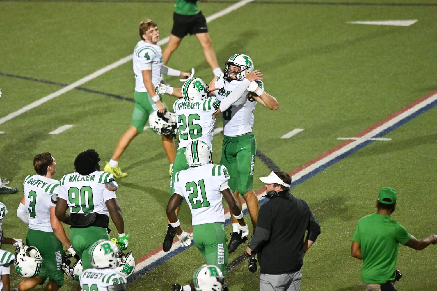 Roswell kicker Balint Vorosmarty (26) celebrates with a teammate after kicking the winning field goal against Walton in the final seconds of their game nFriday, August 29, 2025 at Walton High School. (Daniel Varnado/For the Atlanta Journal-Constitution)