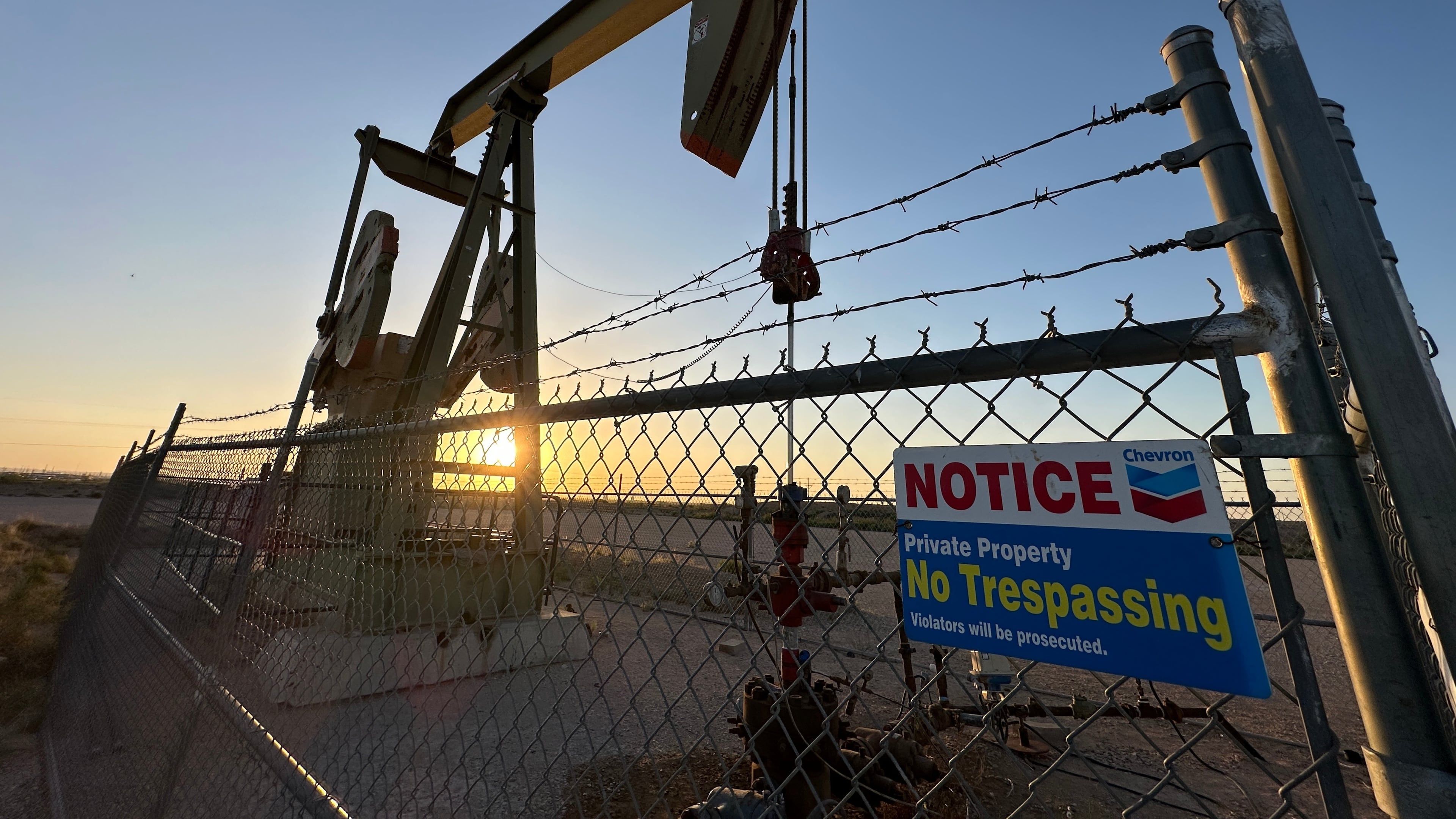The sun sets behind an oil pump jack near Loving, N.M., on Tuesday, May 20, 2025. (AP Photo/Susan Montoya Bryan)