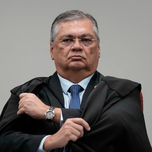 Justice Flavio Dino attends the trial of former Congressman Eduardo Bolsonaro at Brazil's Supreme Court in Brasilia, Tuesday, June 16, 2026. (AP Photo/Eraldo Peres)
