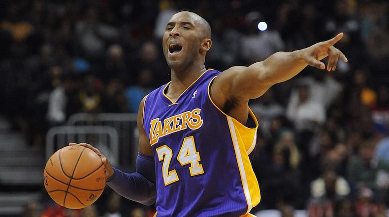 Los Angeles Lakers Kobe Bryant (24) gives instructions to his teammates during the Atlanta Hawks vs the L.A. Lakers basketball game in Philips arena on Monday, December 16, 2013. The Atlanta Hawks won the game 114 to 100. JOHNNY CRAWFORD / JCRAWFORD@AJC.COM
