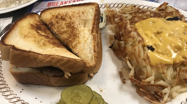 A patty melt with hash browns smothered and covered at Waffle House. LIGAYA FIGUERAS / LFIGUERAS@AJC.COM