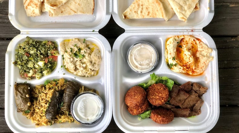 Olive Bistro’s Mediterranean sampler (left) includes tabbouleh, baba ghanoush, dolmas, lentils and rice, and tzatziki; the deluxe falafel platter is at right. CONTRIBUTED BY WENDELL BROCK