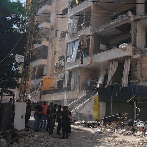 Lebanese security officers gather at the site where an Israeli airstrike hit a building in Dahiyeh, Beirut's southern suburb, Lebanon, Sunday, June 7, 2026. (AP Photo/Hassan Ammar)