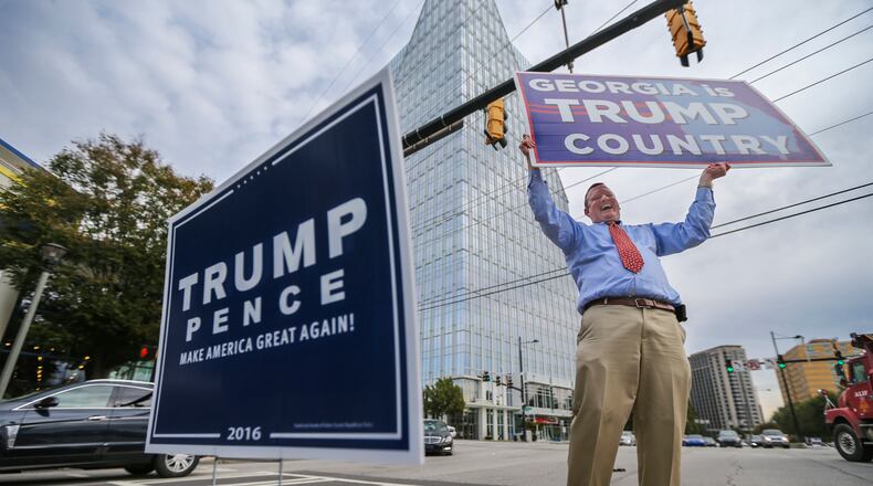 The Justice Department has sought records from Brad Carver, an attorney and Republican activist shown campaigning in November 2020. He was among 16 members of a fake slate of electors as part of Donald Trump's effort to overturn the 2020 presidential election. JOHN SPINK /JSPINK@AJC.COM