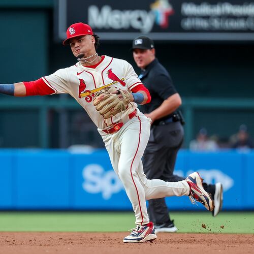 St. Louis Cardinals' Masyn Winn throws to first base for an out against Atlanta Braves' Michael Harris II during the third inning of a baseball game Saturday, July 11, 2026, in St. Louis. (AP Photo/Scott Kane)