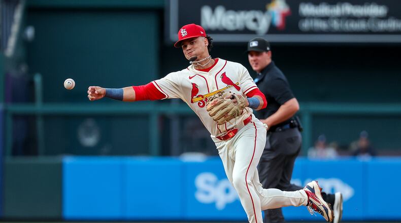 St. Louis Cardinals' Masyn Winn throws to first base for an out against Atlanta Braves' Michael Harris II during the third inning of a baseball game Saturday, July 11, 2026, in St. Louis. (AP Photo/Scott Kane)