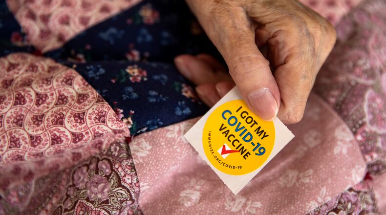 A person displays a sticker after getting a Pfizer-BioNTech COVID-19 at a mobile vaccination site in Oregon on Oct. 6, 2021. (Alisha Jucevic/The New York Times)