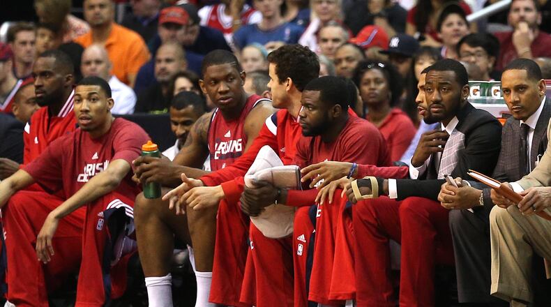 John Wall has been doing light dribbling with his left hand the last two days but says hes uncertain about playing tonight. (Patrick Smith/Getty Images)