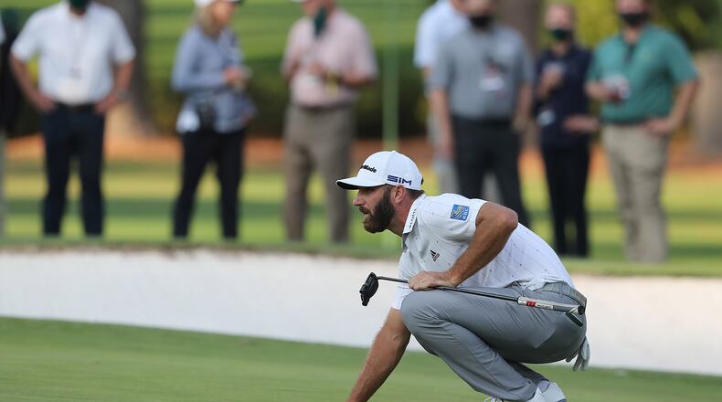 Dustin Johnson looks over a birdie putt on the 15th green during the third round of the Masters at Augusta National Golf Club on Saturday, Nov. 14, 2020, in Augusta, Georgia. (Curtis Compton/Atlanta Journal-Constitution/TNS)