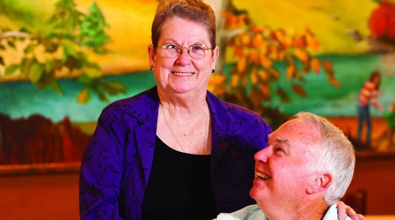 Jo Carter, who had been the Goodwill Ambassador at Mary Mac’s Tea Room since 2006, is shown with a patron around 2010. She retired from that job in 2017. CONTRIBUTED BY DEBORAH WHITLAW LLEWELLYN