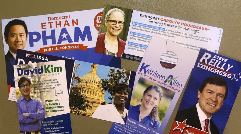 Campaign materials for 7th Congressional District Democratic candidates Carolyn Bourdeaux, Melissa Davis, Kathleen Allen, Ethan Pham, David Kim and Steve Reilly. Curtis Compton/ccompton@ajc.com