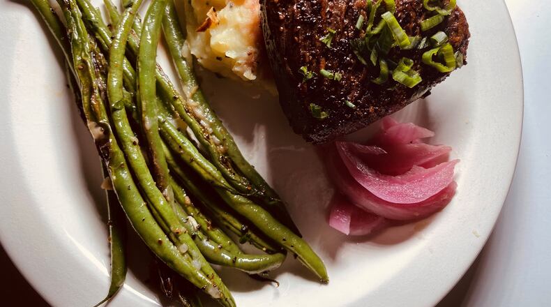 Hanger Steak with green beans, smashed potatoes and pickled onions.
Bob Townsend for the Atlanta Journal-Constitution