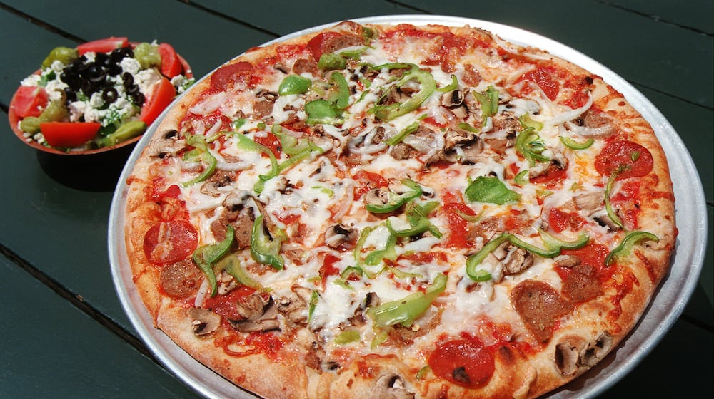 Mo's Deluxe pizza and Greek salad from Mo's Pizza on Briarcliff Road in Atlanta. (PHIL SKINNER/staff).