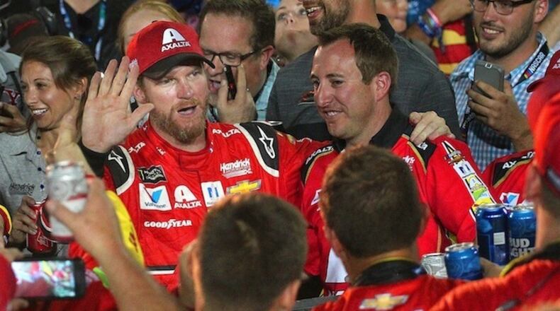 Dale Earnhardt Jr. toasts with beers with his pit crew as he ended his NASCAR career following the Ford EcoBoost 400 on Sunday, Nov. 19, 2017 at the Homestead-Miami Speedway in Homestead, Fla. Earnhardt Jr. also waved to many of his fans as they bid him farewell. (Carl Juste/Miami Herald/TNS)