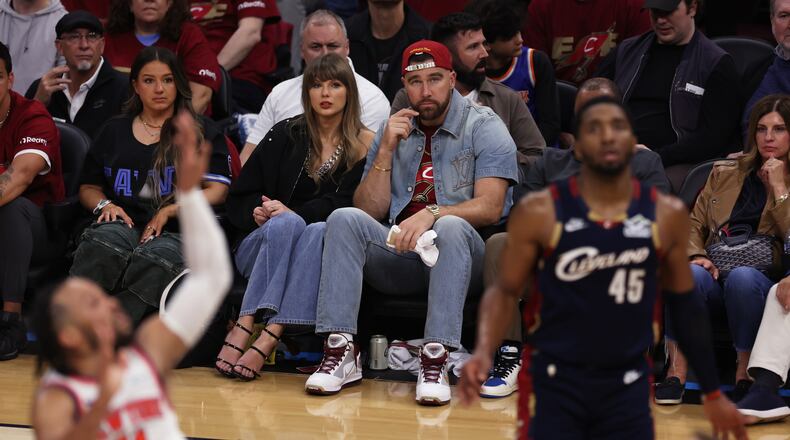 Taylor Swift and Travis Kelce watch the second half of Game 3 in the Eastern Conference finals NBA basketball playoffs series between the New York Knicks and the Cleveland Cavaliers in Cleveland, Saturday, May 23, 2026. (AP Photo/Tim Phillis)