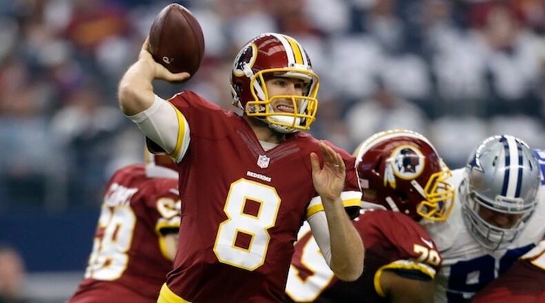 Washington Redskins quarterback Kirk Cousins (8) looks to pass under pressure in the first half of an NFL football game against the Dallas Cowboys on Sunday, Jan. 3, 2016, in Arlington , Texas. (AP Photo/Tim Sharp)
