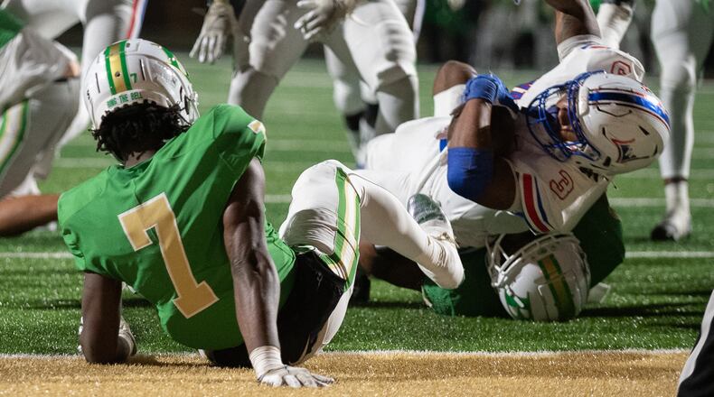 Makari Bodiford, running back for Walton is tackled during the Walton vs. Buford High School Football game on Friday, Nov. 18, 2022, at Buford High School in Buford, Georgia. (Jamie Spaar for the Atlanta Journal Constitution)
