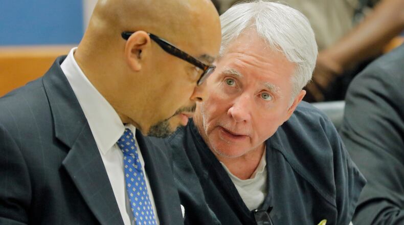 Claud “Tex” McIver confers with one of his attorneys, William Hill (left). McIver was back in court Thursday, Sept. 12, for pre-trial motions in advance of his trial on Oct 30.