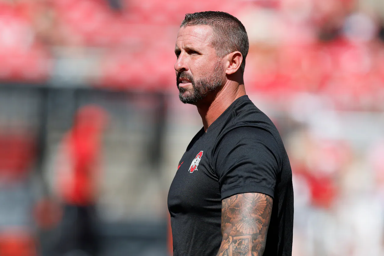 FILE - Ohio State offensive coordinator and wide receivers coach Brian Hartline stands on the field before the start of their NCAA college football game against Texas, Aug. 30, 2025, in Columbus, Ohio. (AP Photo/Jay LaPrete, File)