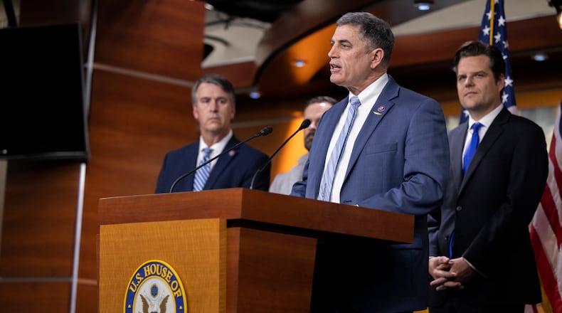 U.S. Rep. Andrew Clyde (center) is the only member of Georgia's congressional delegation not to sign on to a letter supporting more disaster assistance for the state. Clyde, through his office, said he supports aid but he wants it offset by budget cuts. (Nathan Posner for the AJC 2022)