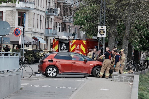 Police and rescue workers on Sortedam Dossering where a car has run into a crowd, Copenhagen, Wednesday, April 30, 2025. (Thomas Traasdahl/Scanpix via AP)