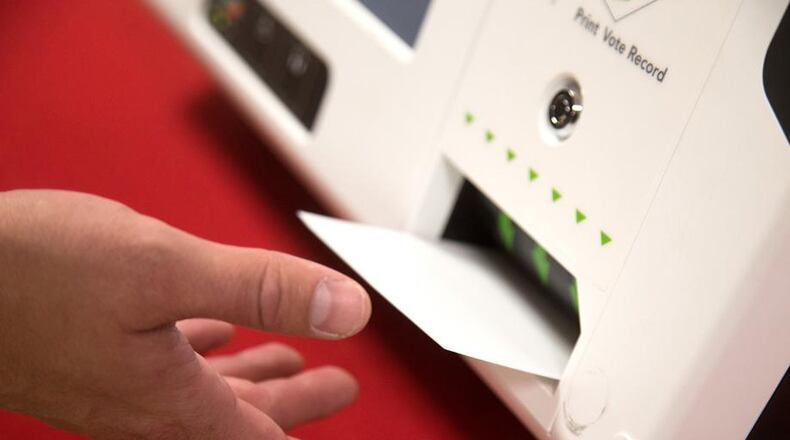 Georgia’s lawmakers are considering switching the state’s voting system to use paper ballots. STEVE SCHAEFER / SPECIAL TO THE AJC