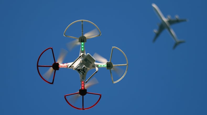 OLD BETHPAGE, NY - SEPTEMBER 05: A drone is flown for recreational purposes as an airplane passes nearby in the sky above Old Bethpage, New York on September 5, 2015. (Photo by Bruce Bennett/Getty Images)