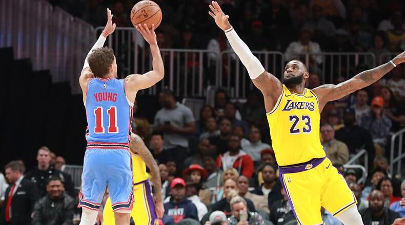 Hawks guard Trae Young shoots over one noted former Rookie of the Year in a February game against the Los Angeles Lakers. (Curtis Compton/ccompton@ajc.com)