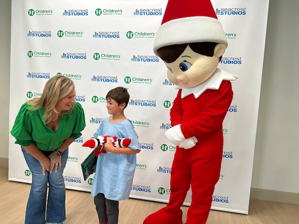 Chanda Bell meets with Children's Healthcare patient Zane Threlkeld at the Ryan Seacrest Studios. (Rodney Ho/AJC)