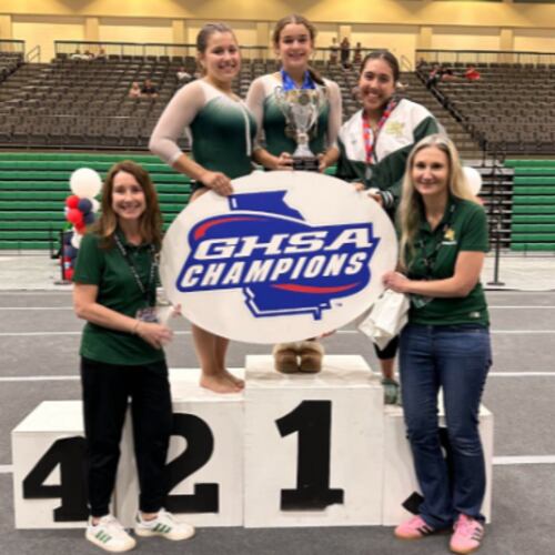 Blessed Trinity started its first gymnastics team this season. The Titans — made up of coach Bethany Cotter (from left), Chloe Seng, Gabriella Perez, Isabella Sutapaha and coach Nicole Irvin — won their first state championship on Friday, April 24, 2026. (Courtesy of the Georgia High School Association)