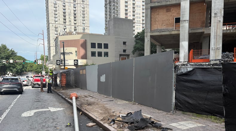 Collapsed scaffolding outside a construction site on 14th Street in Midtown early Sunday, June 12, 2026, prompted speculation and questions on social media and among Midtown residents. (Zachary Hansen/AJC)