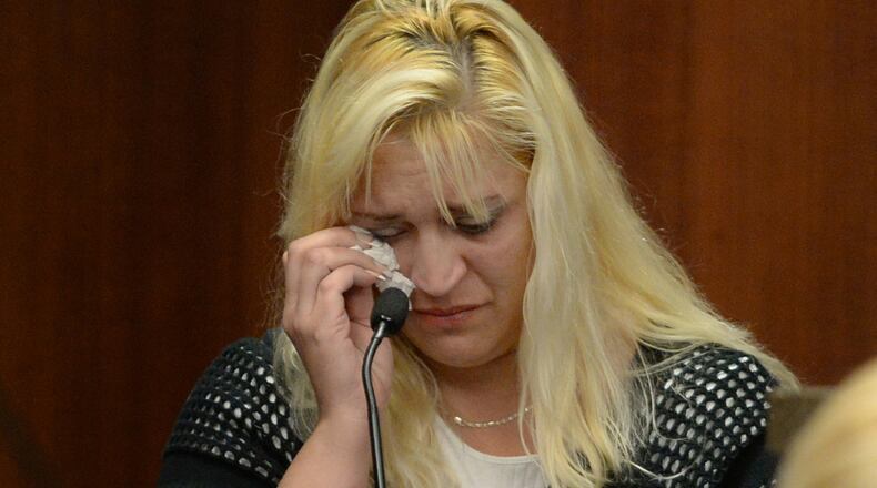 Sherry West, mother of slain toddler Antonio Santiago, testifies in Judge Stephen Kelley's courtroom on Tuesday, Aug. 27, 2013, in Marietta during the murder trial of De'Marquise Elkins, the Brunswick teen accused of shooting her toddler in the face. (AP Photo/Atlanta Journal-Constitution,Johnny Crawford)