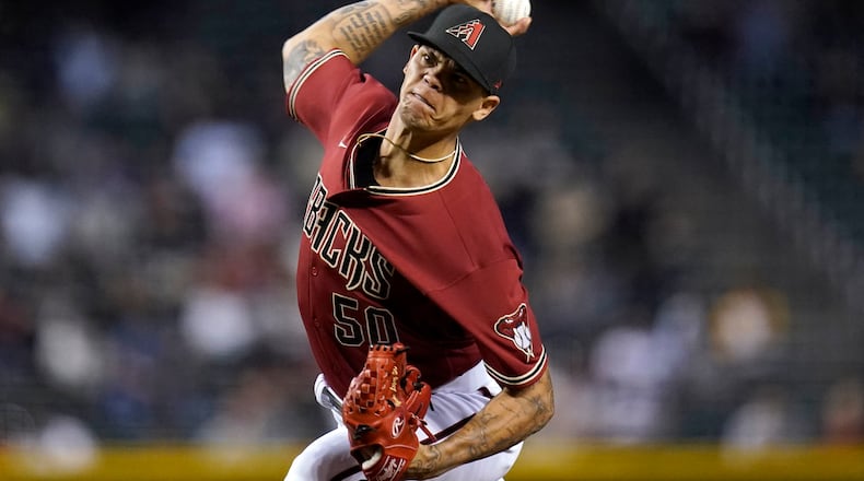 Arizona Diamondbacks relief pitcher Yoan Lopez throws a pitch against the San Diego Padres during the eighth inning of a baseball game Wednesday, April 28, 2021, in Phoenix. (AP Photo/Ross D. Franklin)